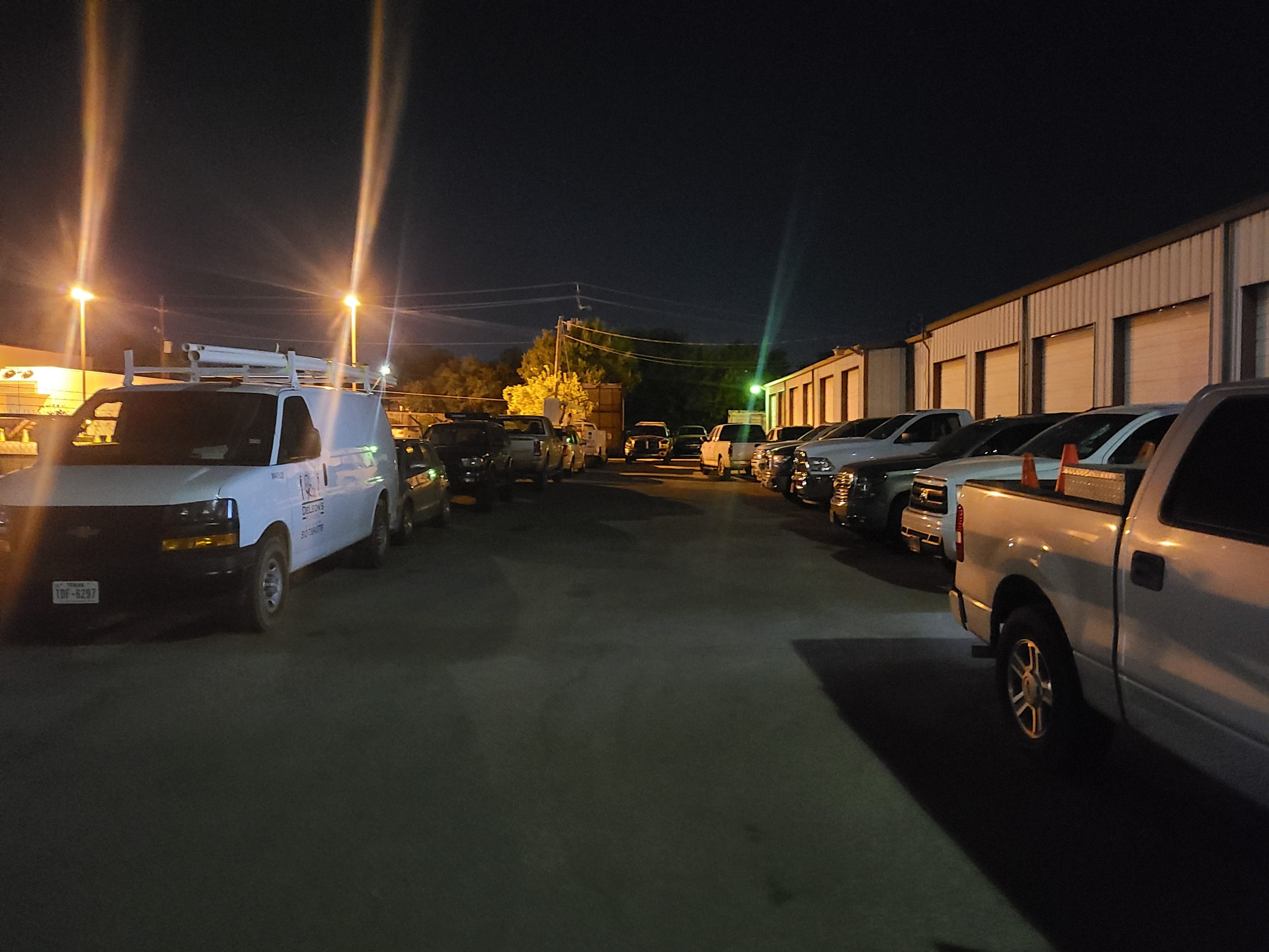 Riley Auto Care shop interior with vehicles on lifts during auto repair in San Marcos TX