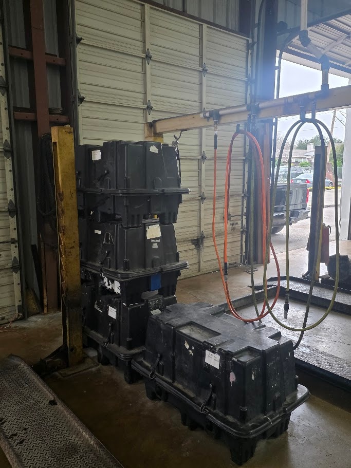 Riley Auto Care technician performing engine diagnostics and transmission repair in San Marcos TX