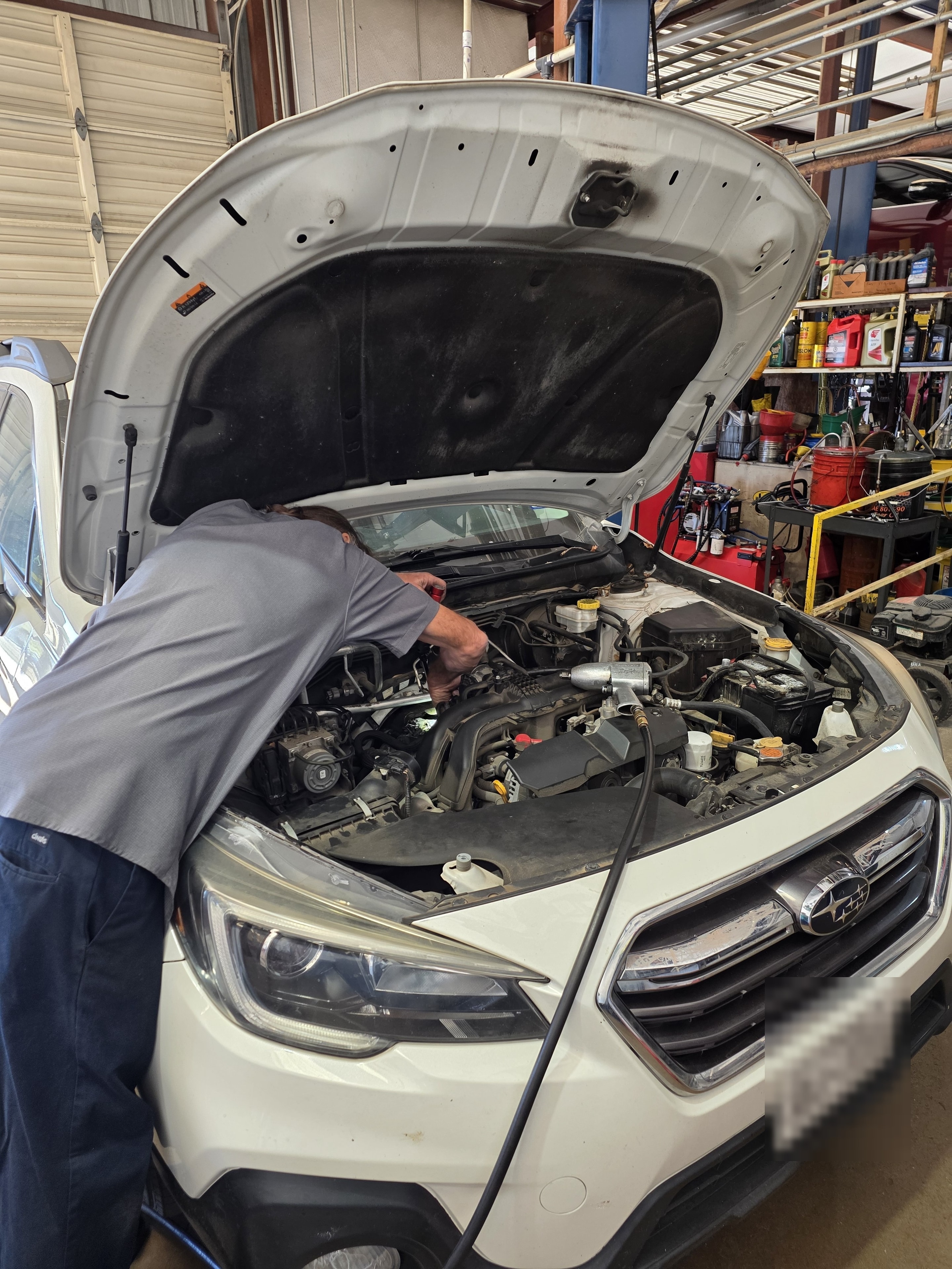 Riley Auto Care mechanic performing auto repair and maintenance service in San Marcos Texas