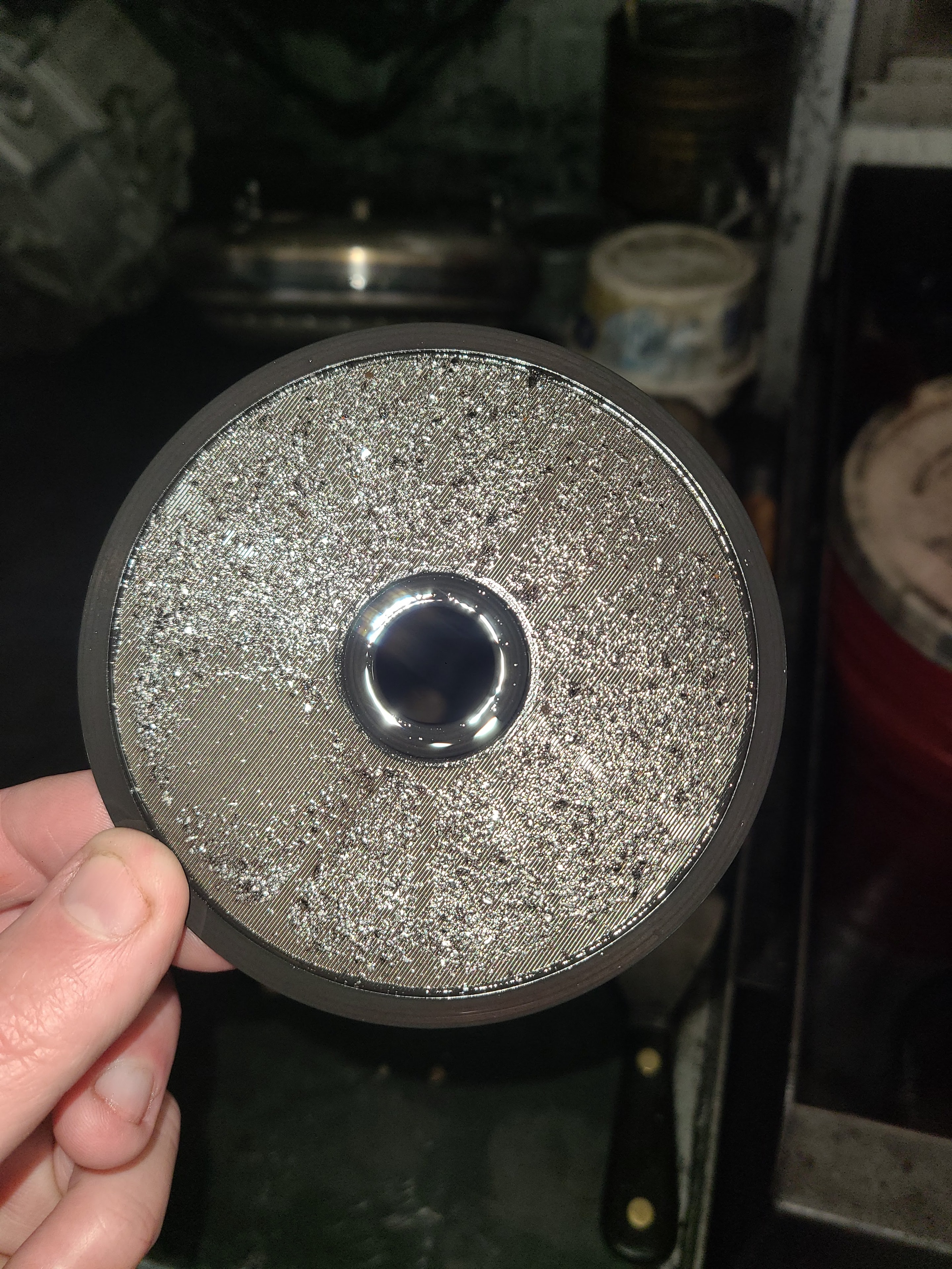 Hot oil flush machine return filter showing heavy metallic debris and shavings flushed from a transmission cooler at Riley Auto Care San Marcos TX