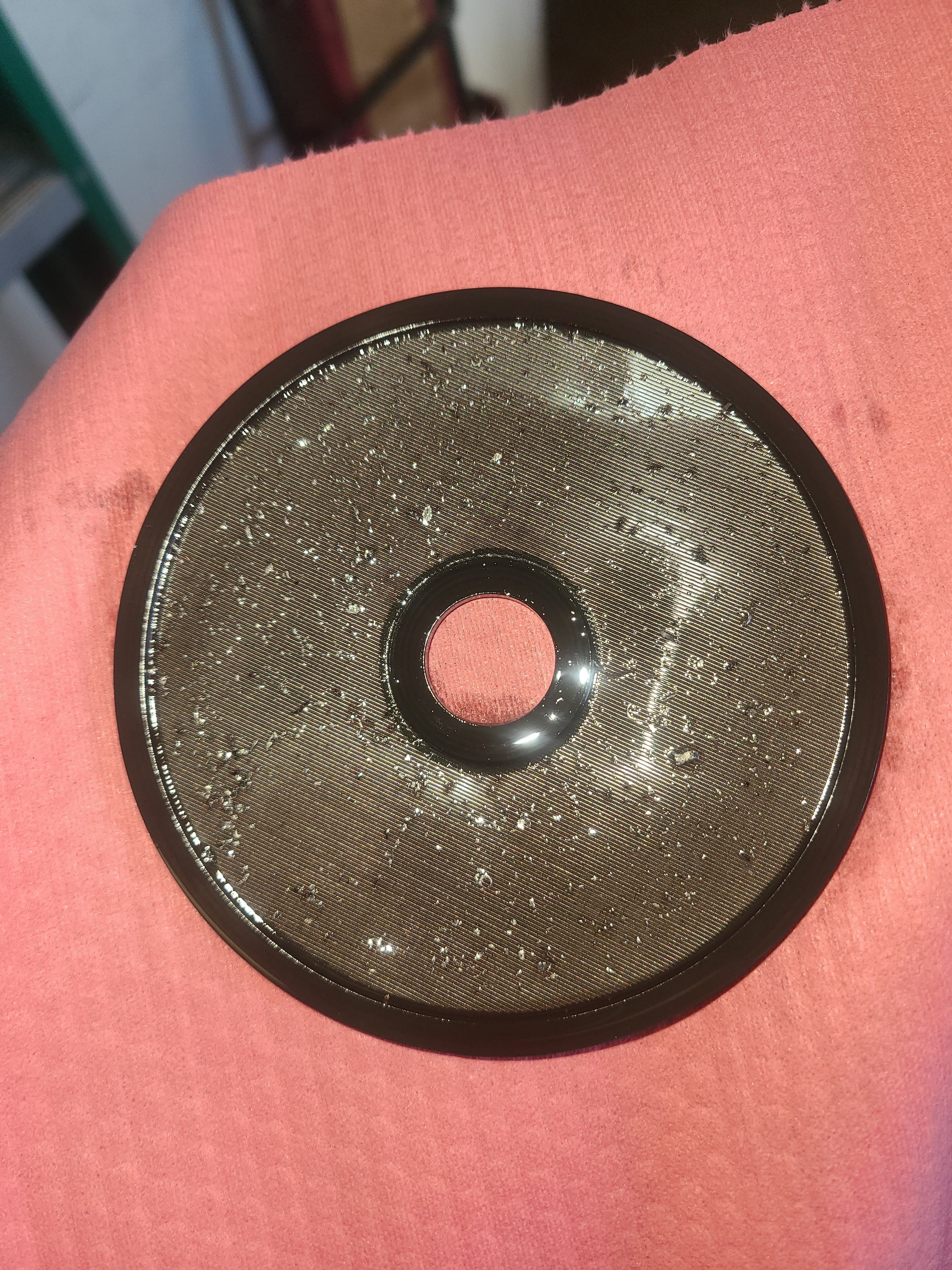 Hot oil flush machine filter showing light metallic contamination captured from transmission cooler during service at Riley Auto Care San Marcos TX